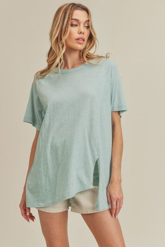 "Olivia Asymmetrical Front Slit Round Neck Raglan Sleeve T-Shirt – Modern & Chic, Unique Front Slit Detail, Classic Raglan Sleeves, Perfect for Casual Cool Style"